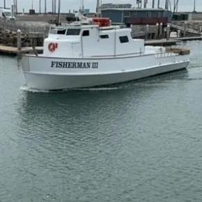 a boat is docked next to a body of water