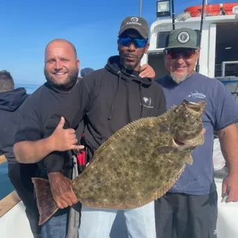 a man holding a fish