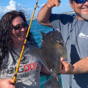 a man holding a fish